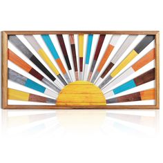 a wooden framed artwork with multicolored lines in the shape of an abstract sun