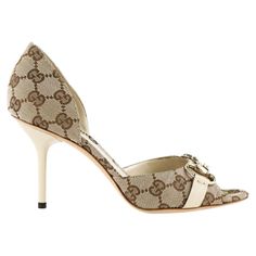 The Gucci pumps are coated in the most popular beige/ebony GG fabric and trimmed in ebony leather trim, thus its neutral style makes it classic for years to come and versatile to go along with most your outfits in the closet. It would be just a very simple and ordinary pump if not for the light gold horsebit at front which greatly accents up the sumptuousness as well as sophistication of the whole design and completes the timeless design of this pair. Gucci GG Horsebit D'Orsay Peep-toe Pump, Bei Luxury Cream Heels With Leather Sole, Elegant Beige Gucci Heels, Gucci Beige High Heels, Designer Beige Heels With Contrasting Heel Counter, Gucci Beige Round Toe Heels, Luxury Beige Heels With Contrasting Heel Counter, Gucci Beige Leather Heels, Designer Cream Heels With Leather Sole, Chic High Heels