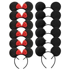 mickey mouse ears with red bows and black hair clips on top of each earband