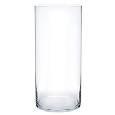 a tall glass vase sitting on top of a table