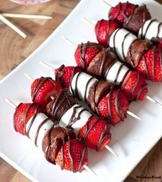 chocolate covered strawberries on skewers with toothpicks