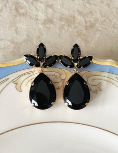 Gorgeous pair of earrings featuring 18x13mm teardrops and 10x5mm marquise Swarovski crystals in jet black.  1 1/4 inches long. Shown in the gold metal finish.  Post backs for pierced ears. Black Drop Teardrop Earrings For Party, Black Teardrop Drop Earrings For Party, Black Teardrop Earrings For Party, Black Crystal Chandelier Earrings, Black Drop Crystal Earrings, Black Crystal Drop Earrings, Black Teardrop Crystal Earrings For Formal Events, Black Crystal Earrings For Wedding, Formal Black Teardrop Crystal Earrings