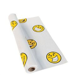 a roll of white wrapping paper with yellow smiley faces on it