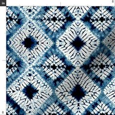 a blue and white tie dye pattern with black dots on it, as well as an image