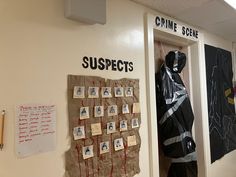 an office hallway with posters on the wall and bulletins attached to the walls that are covered in plastic bags