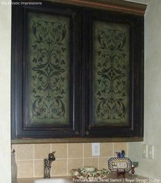 the cabinets are decorated with intricate designs