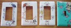 three light switch covers decorated with skulls and flowers