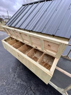 a chicken coop is open and ready to be put into the house or used as a storage shed