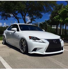 a white car parked in a parking lot