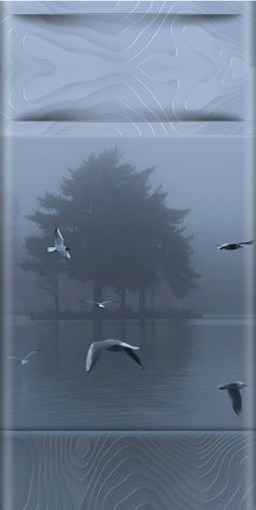 birds are flying over the water and trees in the foggy sky, with an abstract background