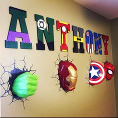 a wall that has some avengers decorations on it and the words antoy written in large letters