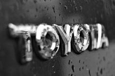 black and white photo of the word toyota