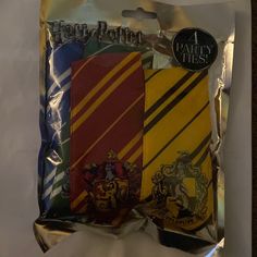 three harry potter themed ties are in the package