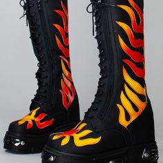 Ignite Your Bold Look With This Hot Anthony Wang X Wtf Gg3 Flaming Fury Black Platform Boots. These Ferocious Rave Festival Boots Feature A Black Colored Vegan Leather Outer, Lace-Up Front With Dual Zipper Closure, Ombre Flame Detailing, Metal Plate Accent, And Chunky Soles. Throw These Rad Af Platform Boots On And Set The Roof On Fire! -Wtf Gg3 Flaming Fury Black Platform Boots -4.5" Heel, 2" Platform -Vegan Leather -Lace Up Detail -Full Side Zip Closure -Flame Applique Detail -Black/Red Flame Applique, Flame Outfit, Flame Shoes, Flame Boots, Heath Burns, Shoe References, Platform Boots Outfit, Fire Boots, Fire Shoes