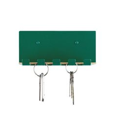 three keys hanging from the hooks on a green wall mounted key holder with two rings