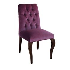 a purple upholstered dining chair with wooden legs and buttoned backrests