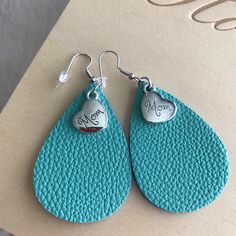 “Mom” Leather Earrings With Silver Charm. Give The Special Mom In Your Life A Unique One Of A Kind Earring. Handcrafted With Lead And Nickel Free Earrings. Leather Earrings Cricut, Cricut Jewelry, Stitch Ears, Mom Earrings, Leather Scraps, Fingerless Gloves Knitted, Purple Baby, Beaded Headband, Nickel Free Earrings