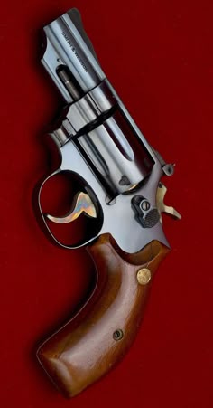 an old revolver on a red background