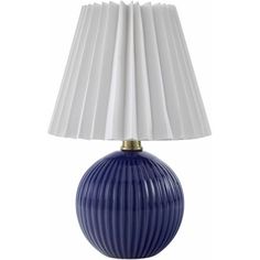 a blue lamp with white pleated shades on it