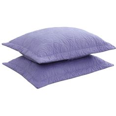 two purple pillows sitting on top of each other