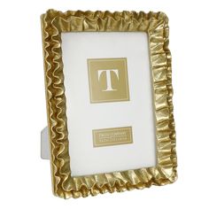 a gold frame with the letter t on it