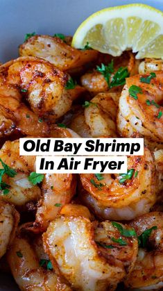 cooked shrimp with lemon wedges and parsley