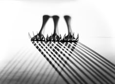 four black and white forks sitting on top of a table