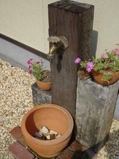 there is a potted planter next to a wooden pole