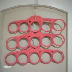 several pairs of scissors hanging on a wall