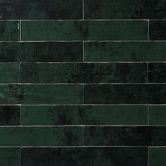 a dark green brick wall with no mortars