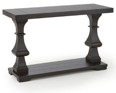 a black wooden table with two legs on it