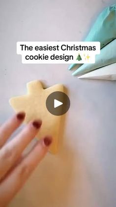 someone is decorating some cookies with icing