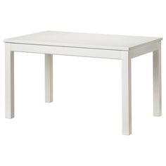 a white table sitting on top of a white floor