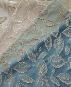 three different fabrics with leaves on them, one in blue and the other in white