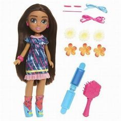 a doll with long hair and accessories in front of a white background that says barbie