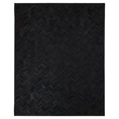 a black rug with an abstract design on it