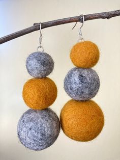 Introducing our beautiful handmade felted wool pom pom earrings with sterling silver ear wires! These earrings are crafted with care, using only the finest materials to ensure their quality and longevity. The pom poms are made of soft, high-quality wool that is felted by hand in a variety of vibrant colors, giving each pair of earrings a unique and eye-catching look. The sterling silver ear wires are hypoallergenic, providing a comfortable and secure fit for sensitive ears. Lightweight and easy to wear, these earrings are perfect for adding a pop of color and texture to your everyday look, or for dressing up a special occasion outfit. They also make a thoughtful and unique gift for someone you love. With their handmade craftsmanship and timeless design, these felted wool pom pom earrings a Felting Earrings, Christmas Earings, Wool Earrings, Wool Jewelry, Felt Earrings, Felted Earrings, Felted Christmas, Pom Earrings, Large Dangle Earrings