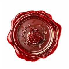 a red glass bowl with a rose in the center and leaves around it on a white background