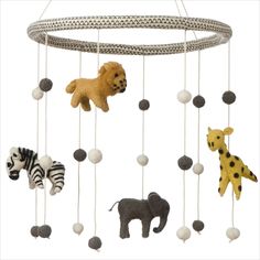 a baby mobile with animals and zebras hanging from it's sides