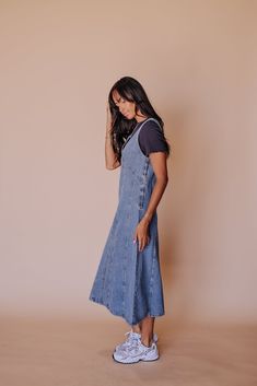 Add a touch of effortless style to your wardrobe with the 90's inspired denim overall dress. Made from medium weight denim, this v-neck dress exudes casual elegance. Side zipper access ensures easy wearing, this dress is a vibe. Model Measurements: Hips 32” Waist 26.5” Bust: 34”, Height 5’9, wearing a size small 100 Cotton Bridesmaid Tops, Denim Overall Dress, Overall Dress, New Arrival Dress, Romper Pants, Trending Dresses, Casual Elegance, V Neck Dress, Dresses Xs