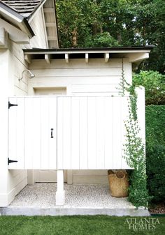 a white shed with a purple border around it