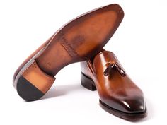 Goodyear welted tassel loafers for men. Brown hand-painted leather upper Antique finished double leather sole Camel color leather lining and inner sole This is a made-to-order product. Please allow 15 days for the delivery. Because our shoes are hand-painted and couture-level creations, each shoe will have a unique hue and polish, and color may differ slightly from the picture. Quality Leather Boots, Loafers Brown, Timeless Shoes, Loafers For Men, Mens Loafers, Brown Leather Loafers, Hand Painted Leather, Tassel Loafers, Painting Leather