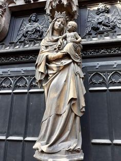 a statue of the virgin mary holding a child