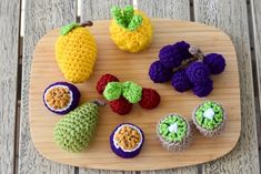 crocheted fruits and vegetables on a cutting board