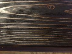 a close up view of the wood grains on a piece of furniture that has been painted brown