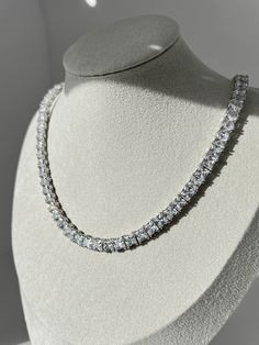 Stunningly elegant and crafted with precision, this tennis necklace of solid sterling silver features rows of dazzling created diamonds for a luxurious, timeless look. With a total carat weight ranging from 55.38TCW (depends on the length), this necklace is perfect for any special occasion or everyday wear. This exquisite necklace has high polished rhodium finish that gives it a stunning shiny look that lasts for many years. Our created diamonds and gemstones are synthetic simulants (NOT natural Pretty Jewelry Necklaces, Silver Chain For Men, Chain For Men, Diamond Simulant, Expensive Jewelry, Tennis Necklace, Diamonds And Gold, Pretty Gift, Gorgeous Gift