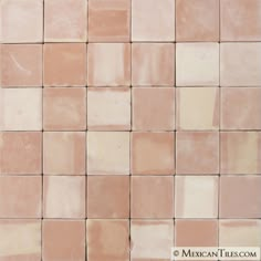 an image of a tile wall that looks like it is made out of pink and white tiles