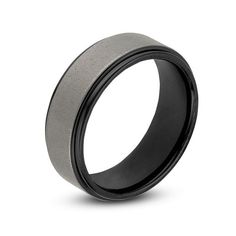 a black and silver wedding ring on a white background