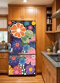 a brightly colored refrigerator in a kitchen with wooden cabinets