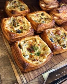 breads with different toppings are on a cutting board and ready to be eaten